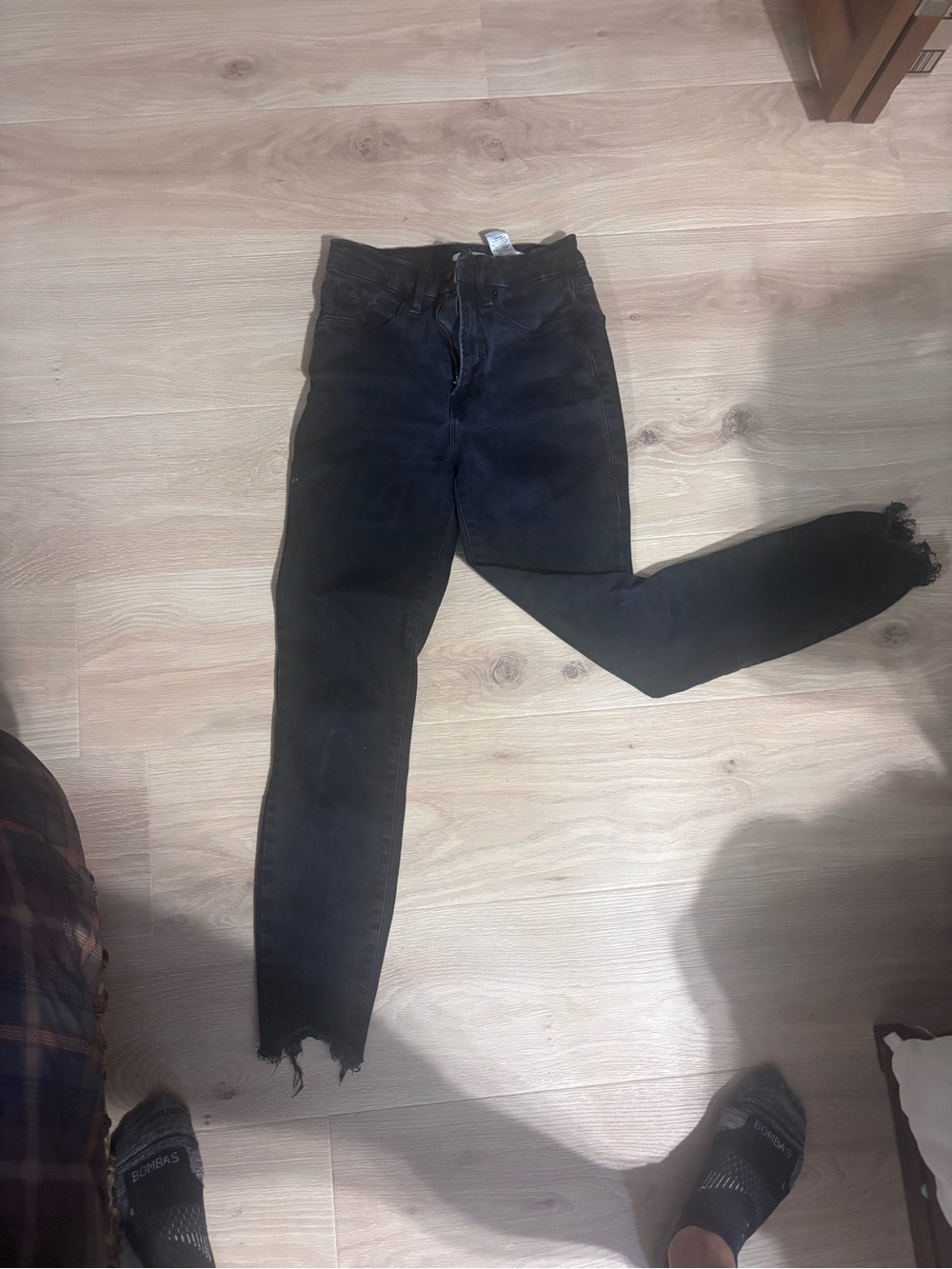 Good American Washed Black High-Rise Skinny Jeans with Raw Hem